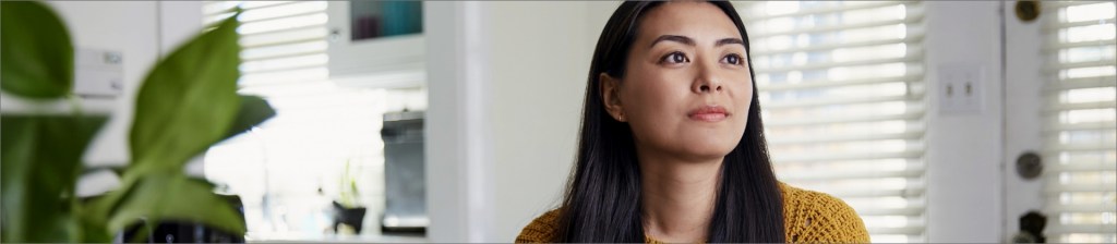 Woman in her home looking off to the right