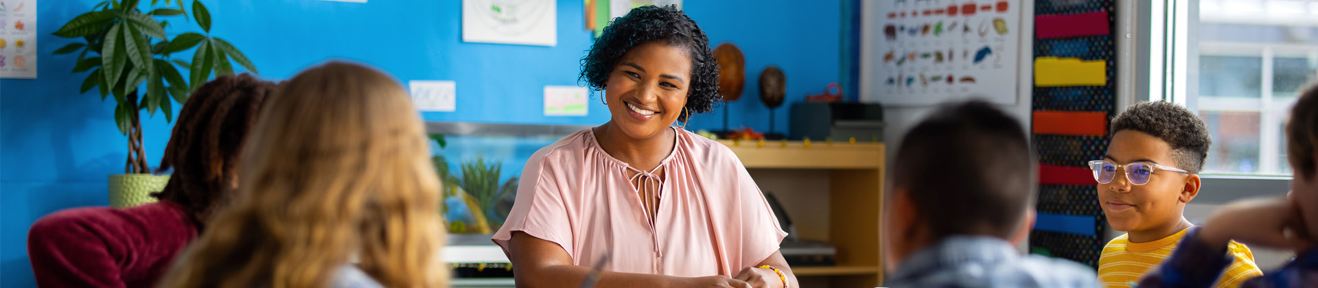 teacher smiling in classroom