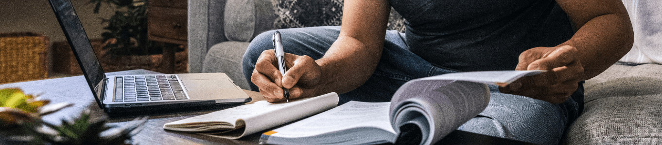 a man studying textbooks