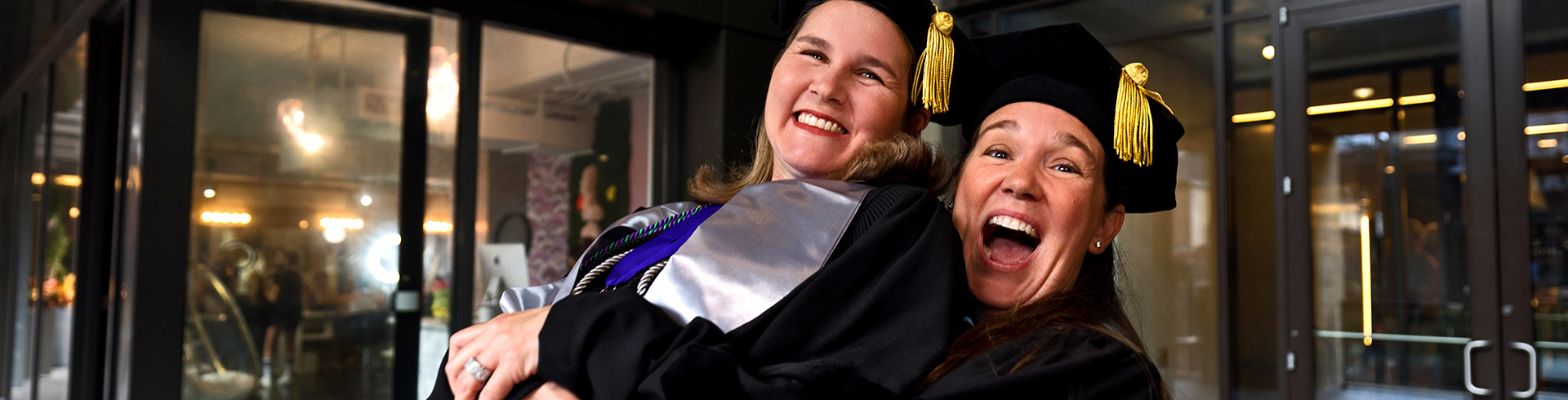 Couple excited at graduation