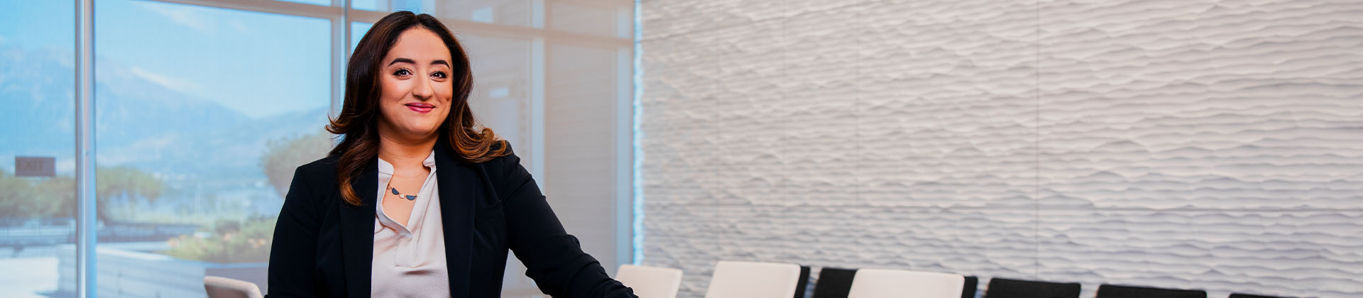 Woman standing at conference room table