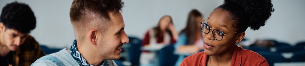 students talking in a classroom